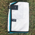 White with Black Check Ripstop rug folded, showing the check and binding