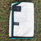 White with Black Check Ripstop rug folded, showing the check and binding